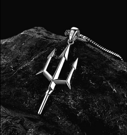 Poseidon Trident Necklace on black rock background showcasing detailed trident design.