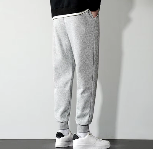 Cristian Sweatpants in gray, featuring a modern fit, elastic waistband, and side pockets, ideal for gym wear and everyday comfort.