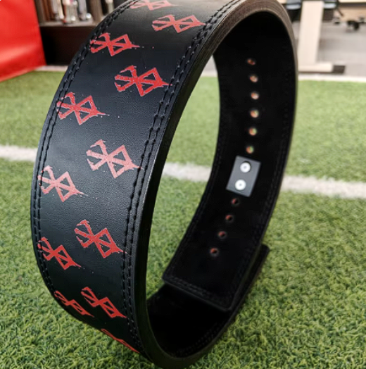 Berserk powerlifting belt made from cowhide leather with red symbols and steel buckle.