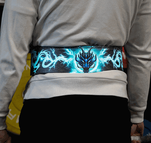 Dragon of Terror powerlifting belt with dragon design, worn by an athlete for strength support.