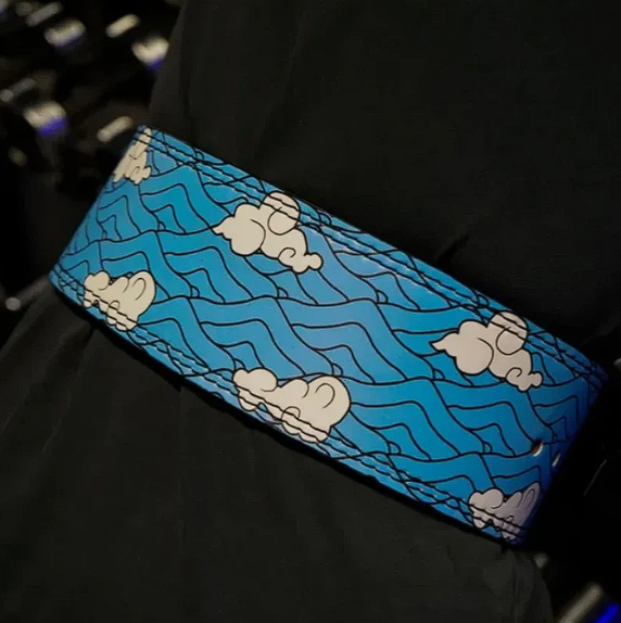 One Piece powerlifting belt with anime-inspired design in blue and cloud pattern.