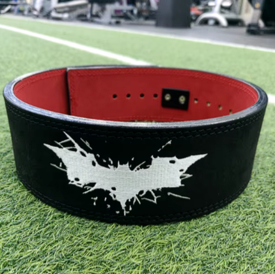 Joker Embroidery Powerlifting Belt with adjustable lever buckle on gym floor.