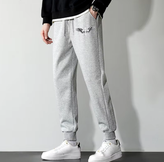 Light grey Cristian Sweatpants with tight fit, elastic waistband, and side pockets for gym and casual wear.