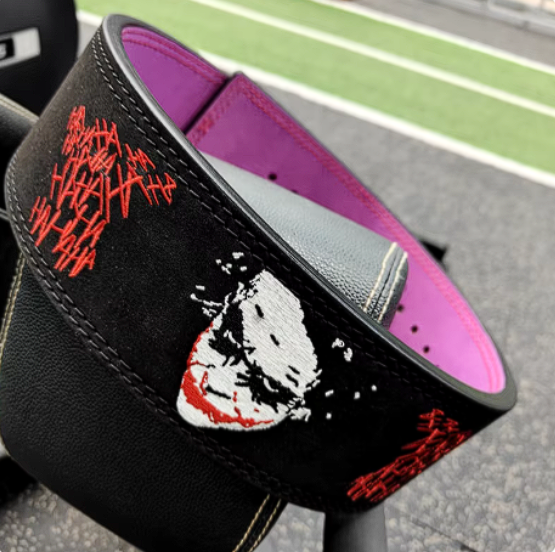 Joker embroidery powerlifting belt with adjustable lever buckle for strength training.