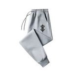 Gray Berserk sweatpants with sleek design and logo.