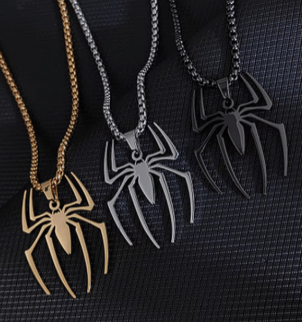 Three stainless steel Spider Necklaces in silver, gold, and black colors, inspired by Spider-Man.